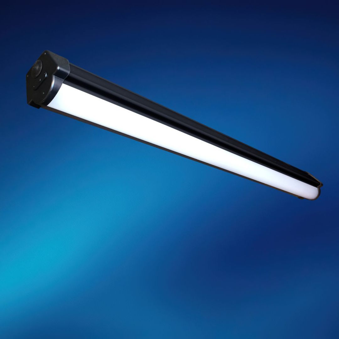 A black light fixture with a white light on a blue background