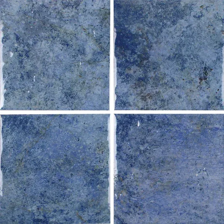 Blue textured ceramic tile pattern with four square tiles separated by white grout lines