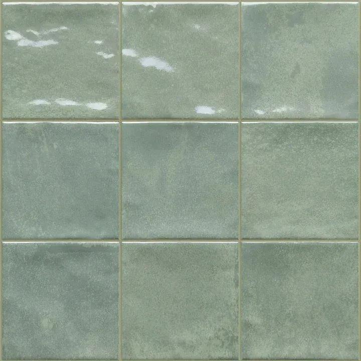 Pale green square ceramic tiles with glossy glaze and visible grout lines