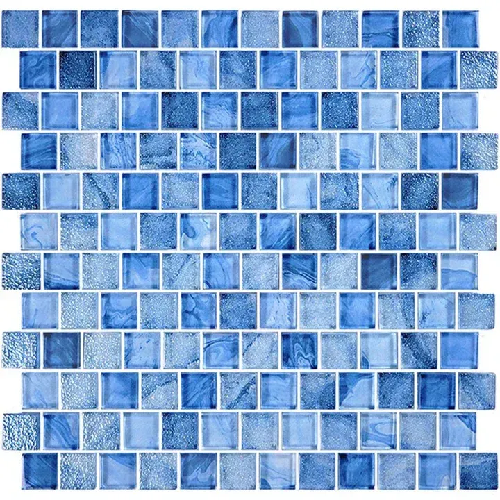Blue mosaic tile pattern with small rectangular tiles in varying shades of blue and white.