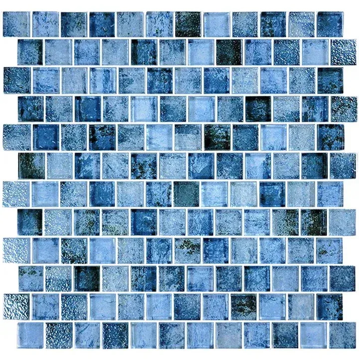 Blue mosaic tile pattern with small square tiles in varying shades of blue and white grout.