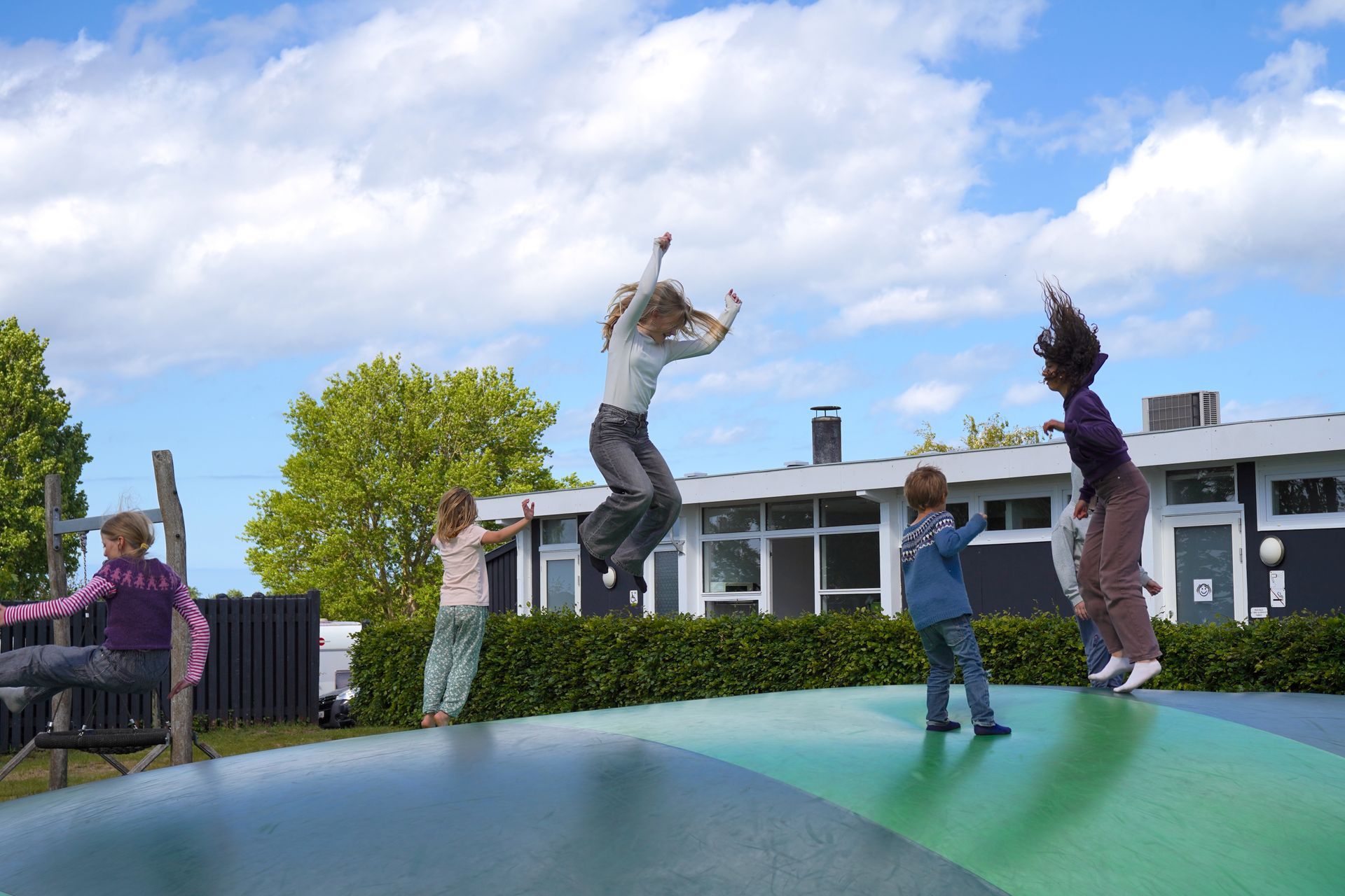 Bouncy cushion with children jumping on it