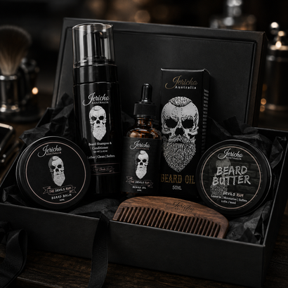 Black gothic grooming gift set with skull graphics in a box, including hair product and comb