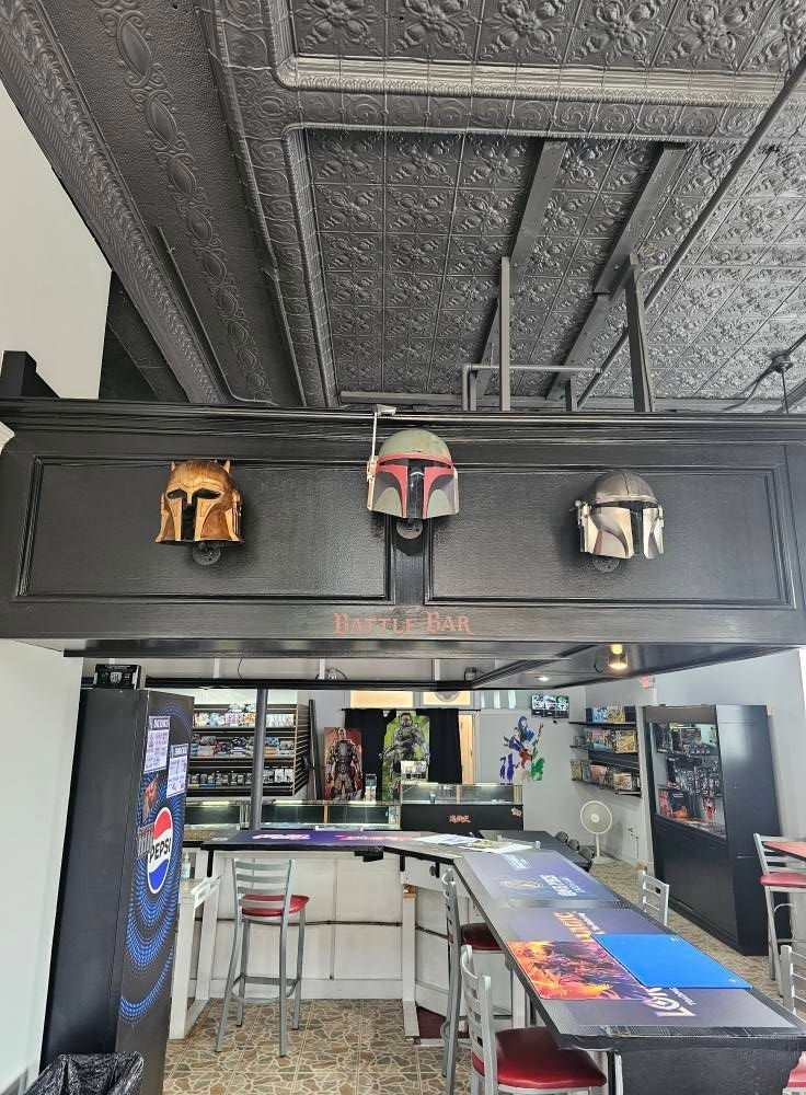 Three Mandalorian helmets above a bar.