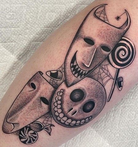 A black and white tattoo of a nightmare before christmas character on a person 's arm.