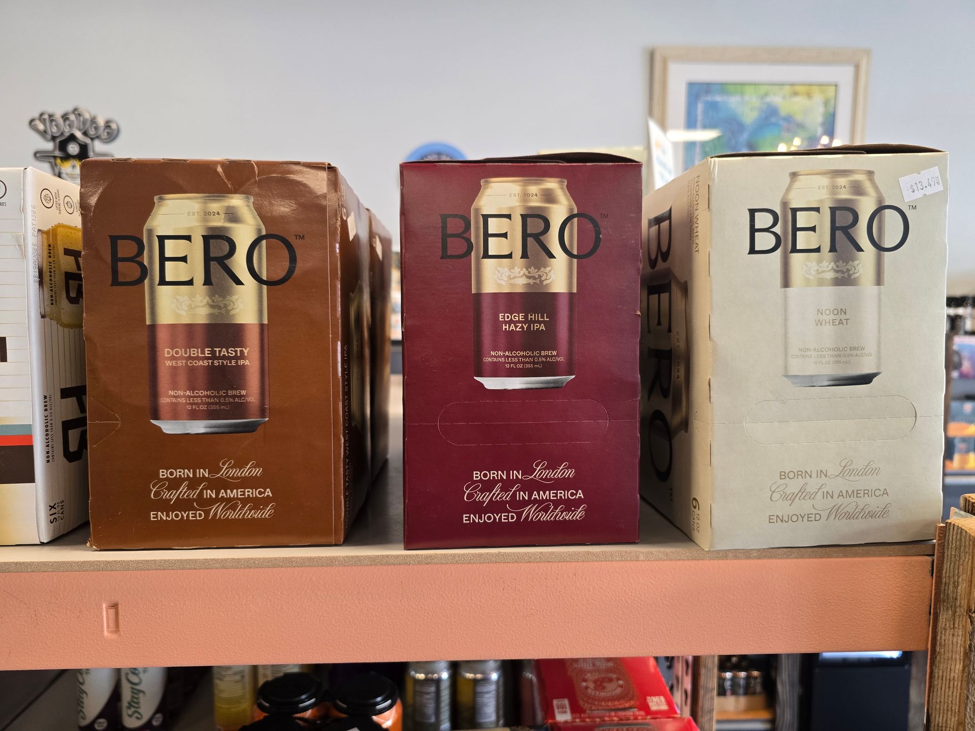 BERO liquor gift boxes in brown, burgundy, and cream on a store shelf