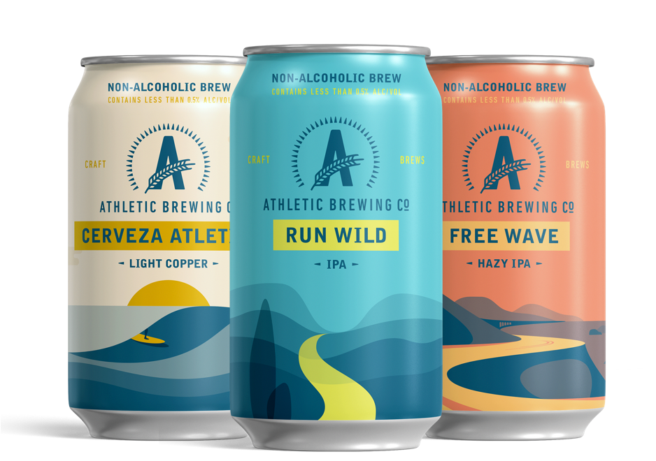 Three Athletic Brewing non-alcoholic beer cans: Cerveza Atletica, Run Wild IPA, and Free Wave Hazy IPA.