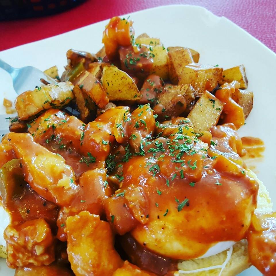 A close up of a plate of food with a fork on it