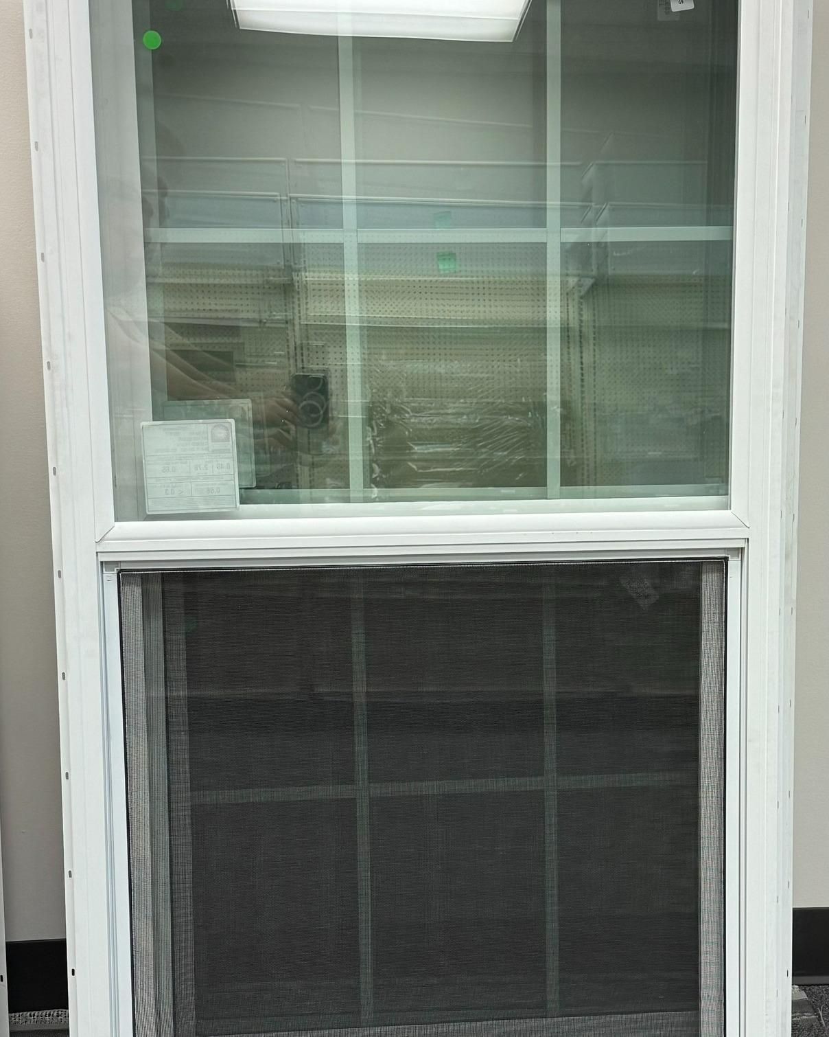 White window with a black screen on the lower half. The window has multiple panes.
