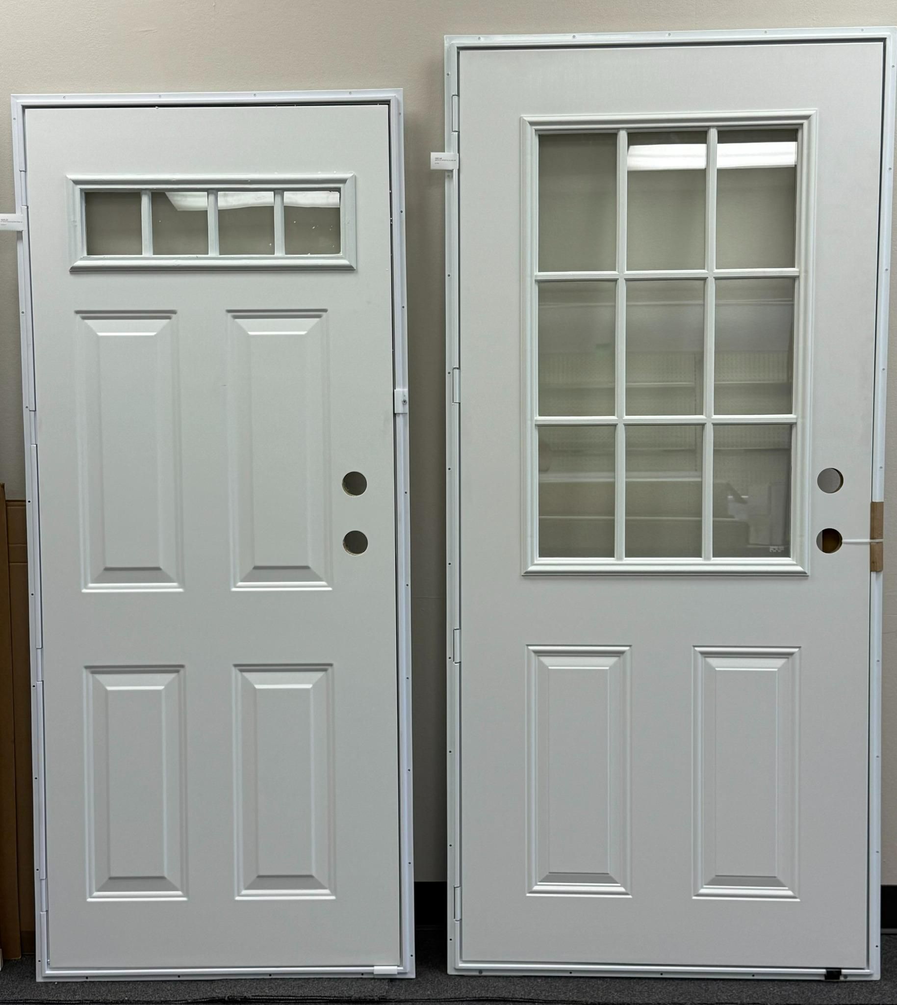 Two white exterior doors with different glass panel designs.