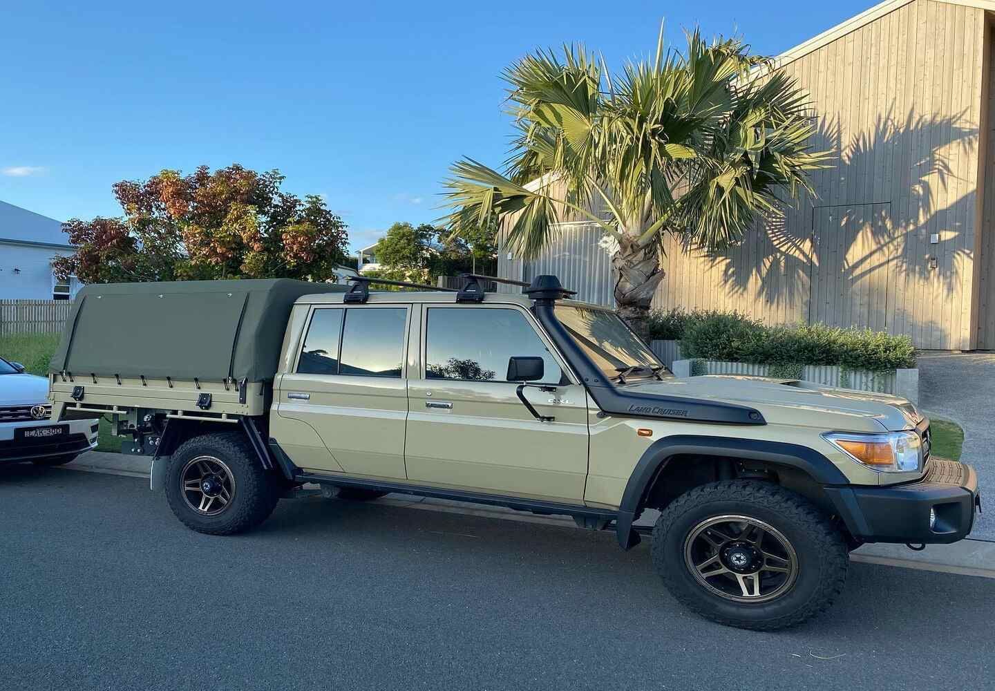 A Truck With A Canopy On Top Of It Is Parked On The Side Of The Road — Currumbin Trimmers In Currumbin Waters, QLD