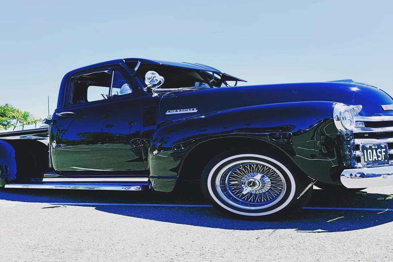 A Blue Truck Is Parked On The Side Of The Road — Currumbin Trimmers In Currumbin Waters, QLD