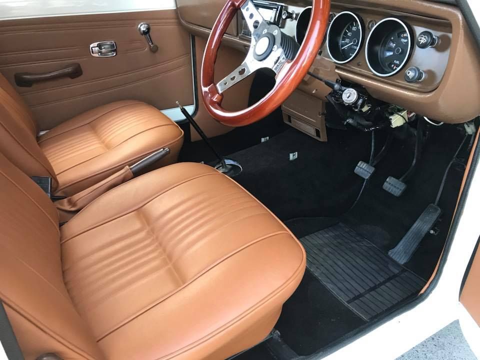 The Interior of a White Car With Brown Leather Seats and a Wooden — Currumbin Trimmers In Murwillumbah, NSW