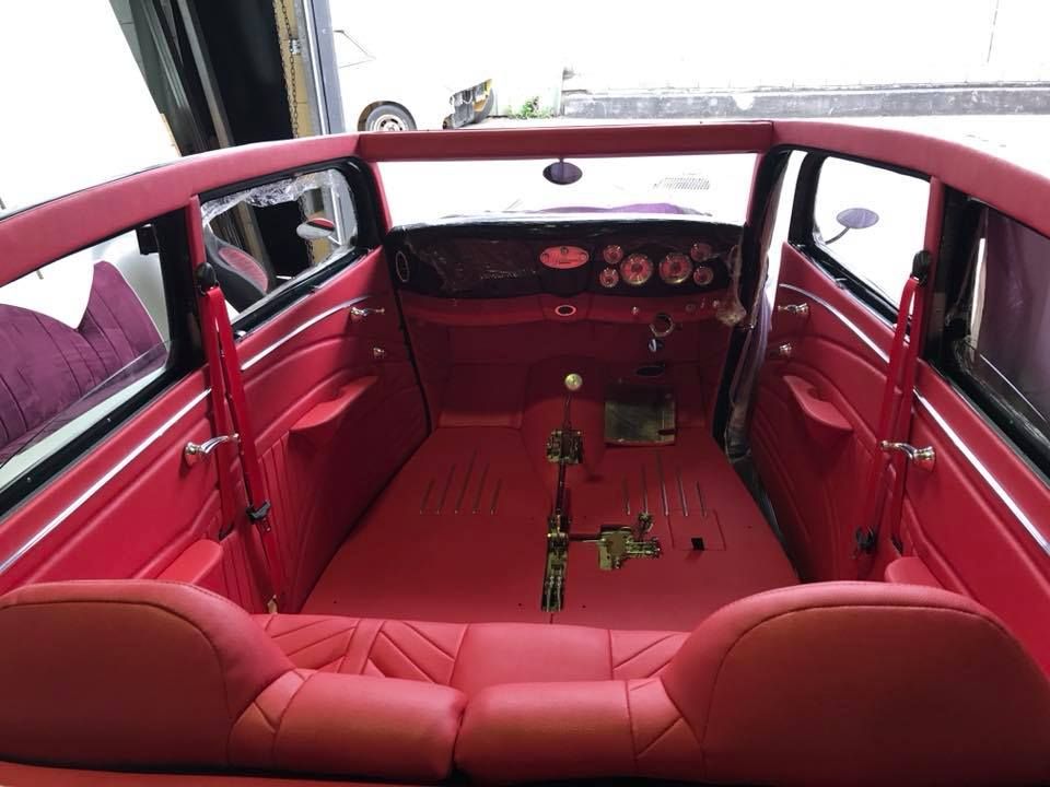 The Inside of a Red Car With Red Leather Seats — Currumbin Trimmers  In Currumbin Waters, QLD