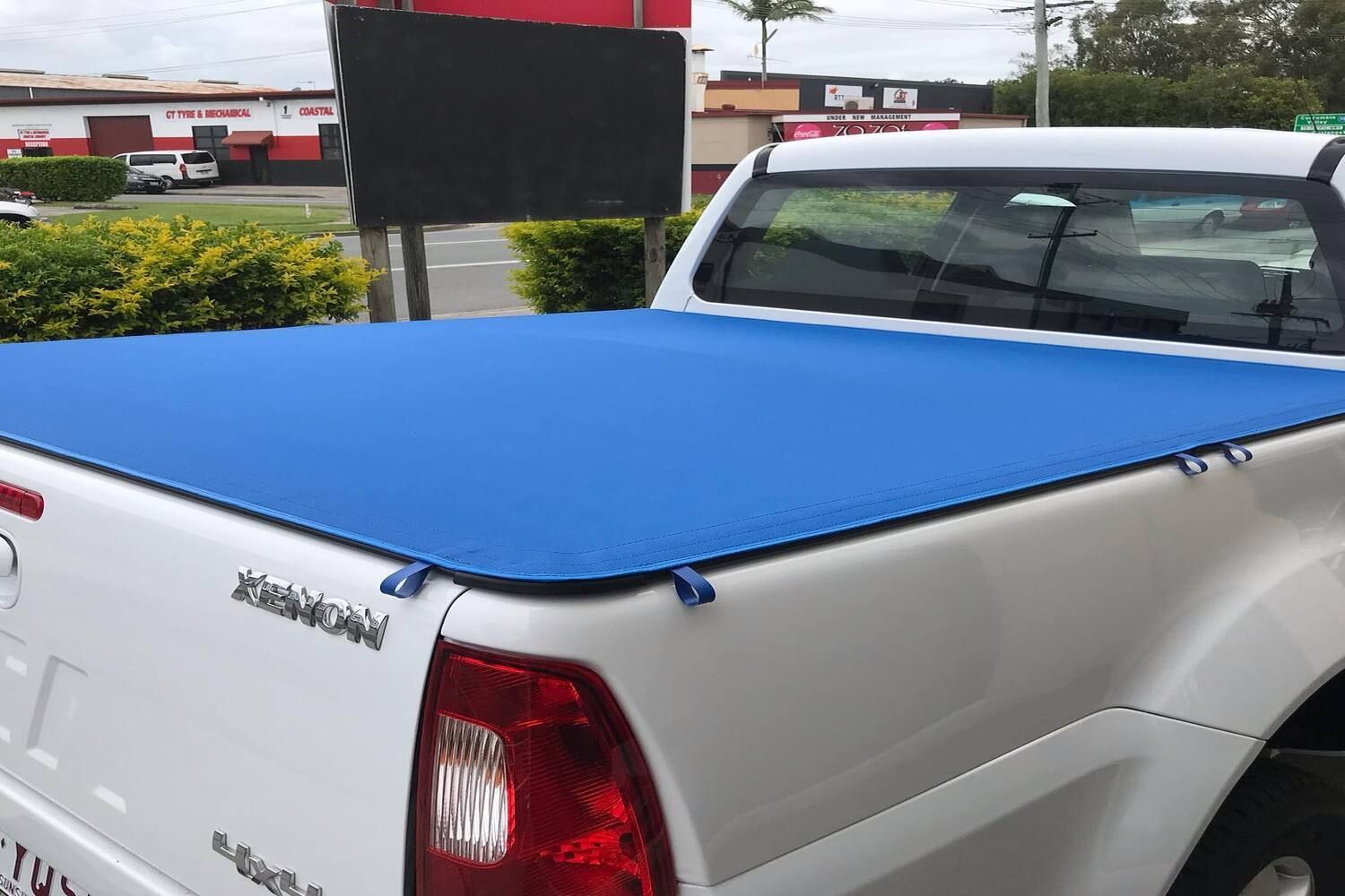 A White Truck With A Blue Tonneau Cover On The Bed — Currumbin Trimmers  In Currumbin Waters, QLD