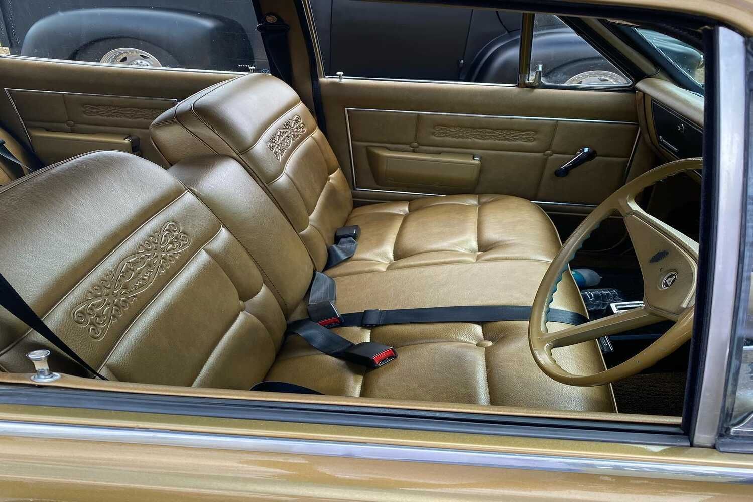 The Inside Of A Car With A Steering Wheel And Seat Belts — Currumbin Trimmers  In Currumbin Waters, QLD