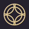 A gold circle with a diamond in the middle on a black background.