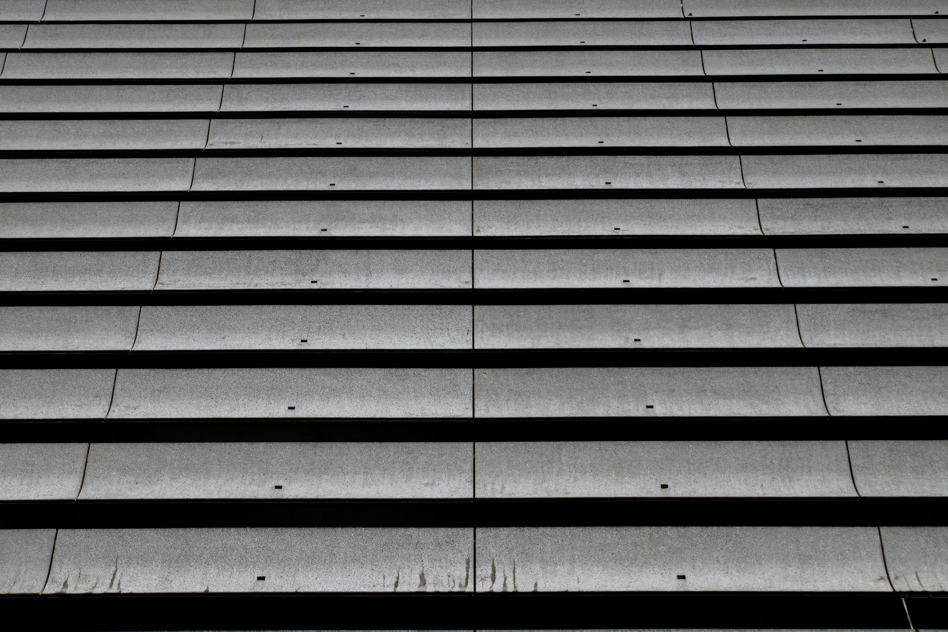 Gray tiled roof, horizontal rows, close-up view.