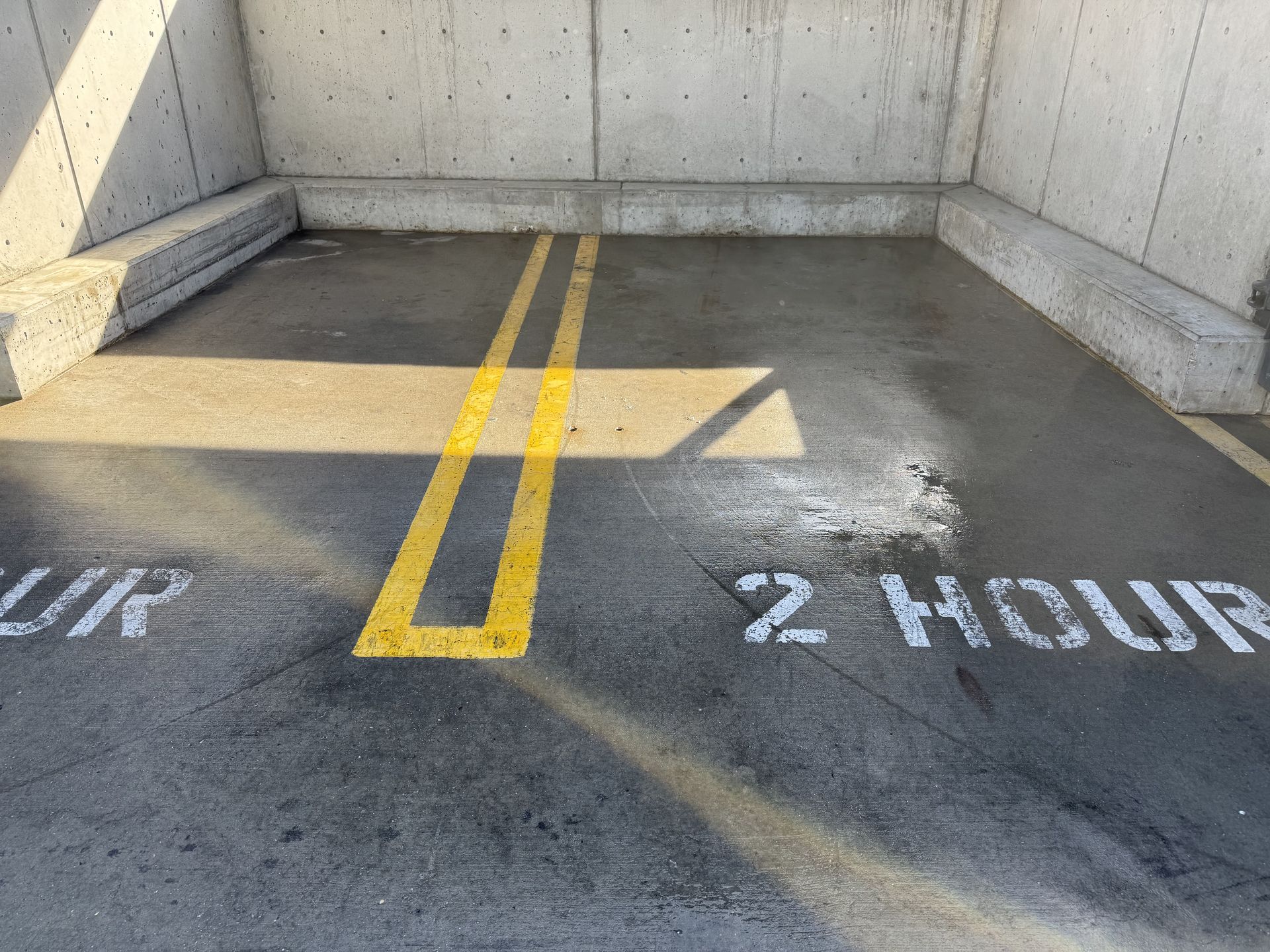 The after photo of the newly pressure cleaned dumpster pad