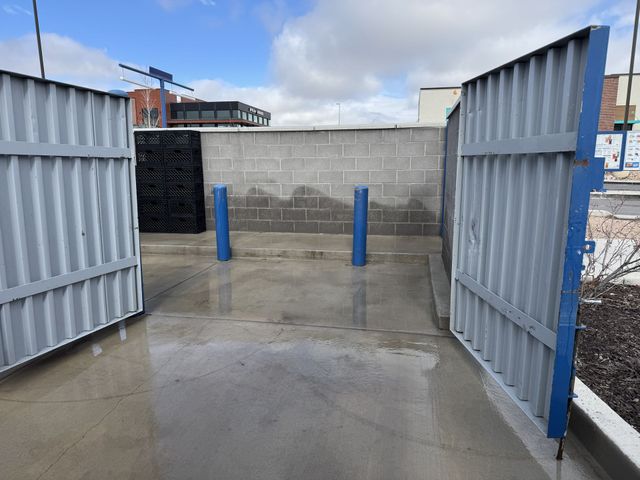 Dumpster pad cleaning and pressure washing
