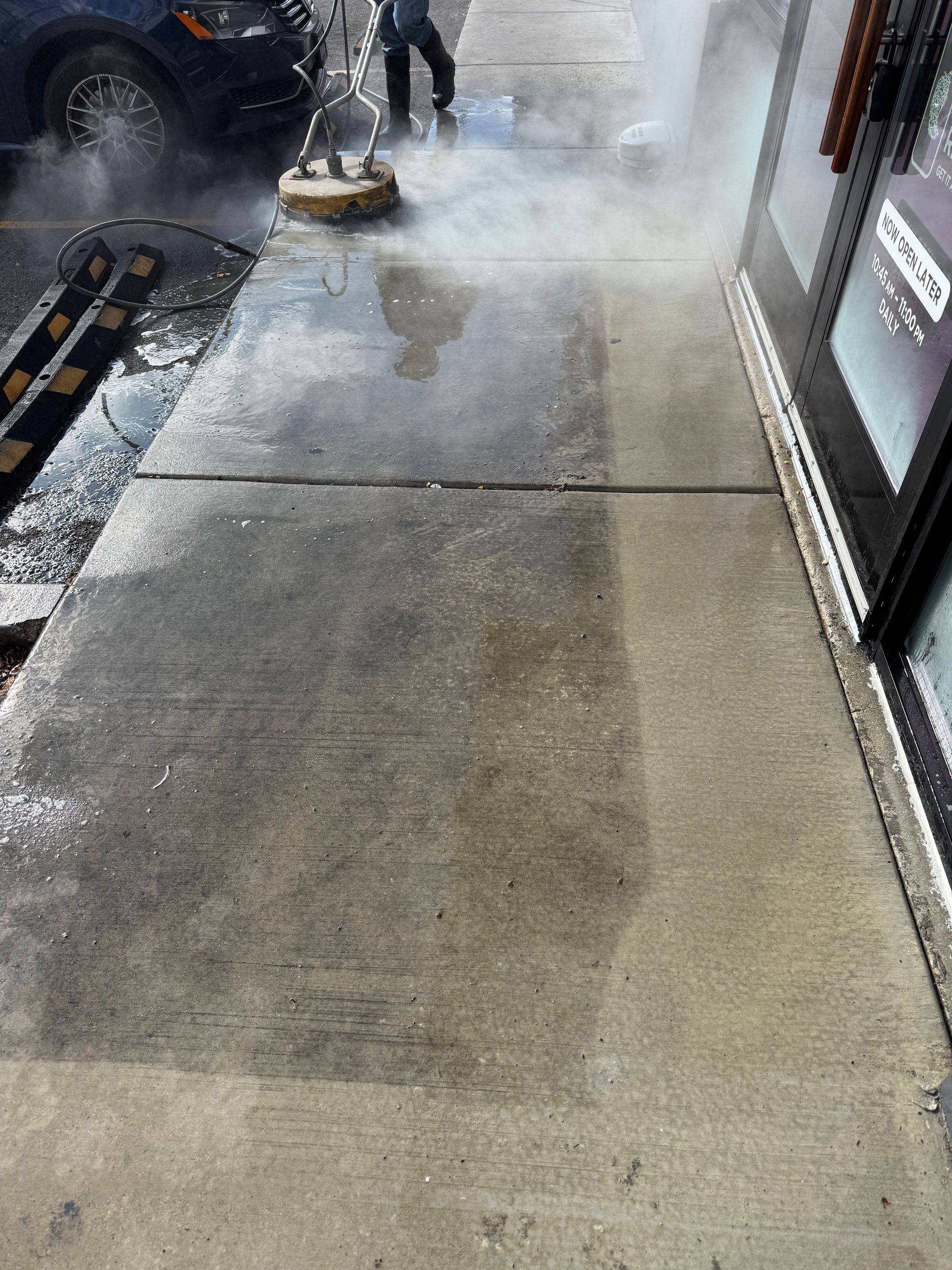 Commercial pressure washing a concrete walkway for a restaurant in Utah