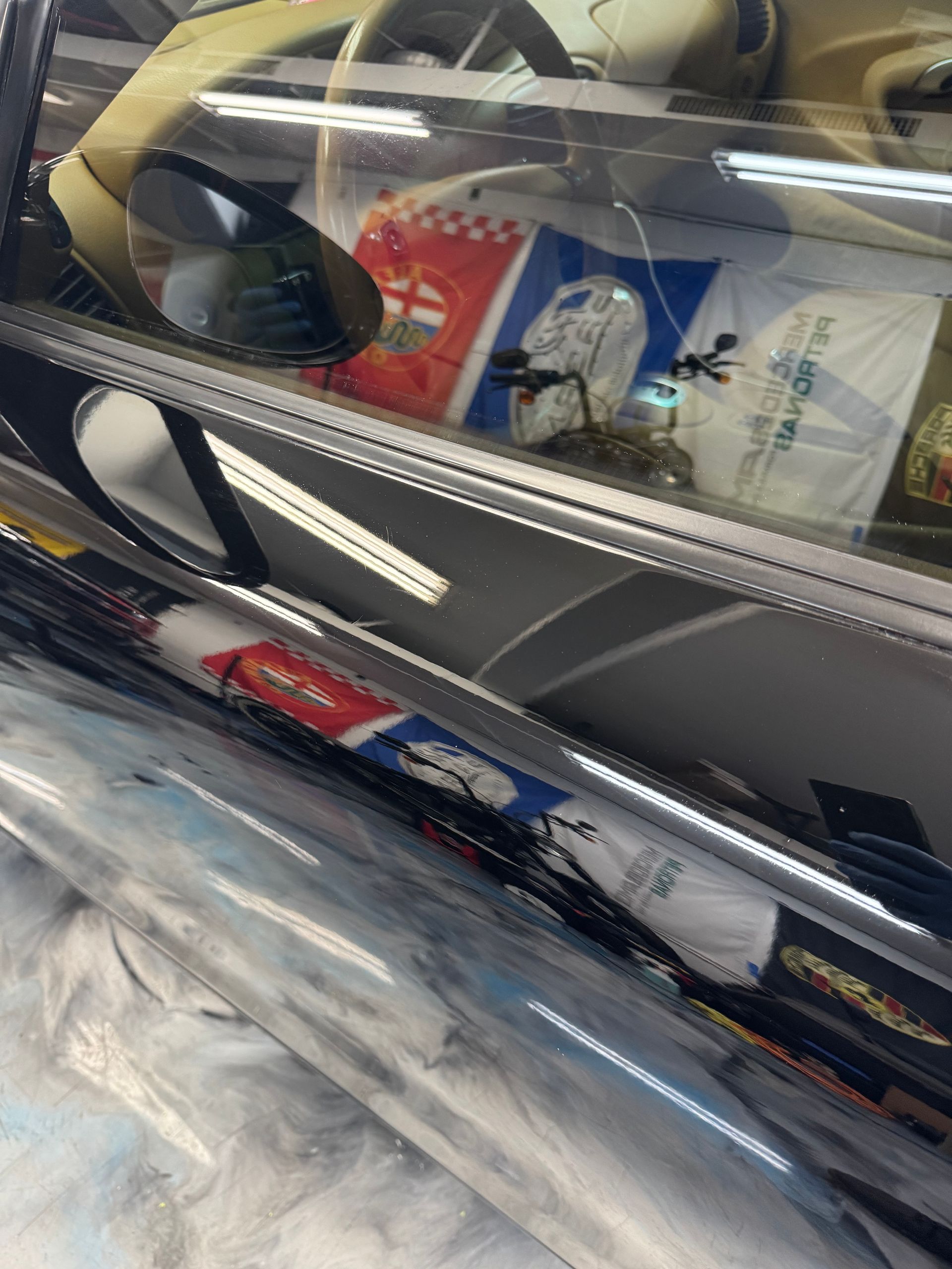 Porsche 911 panel after — clean gloss finish