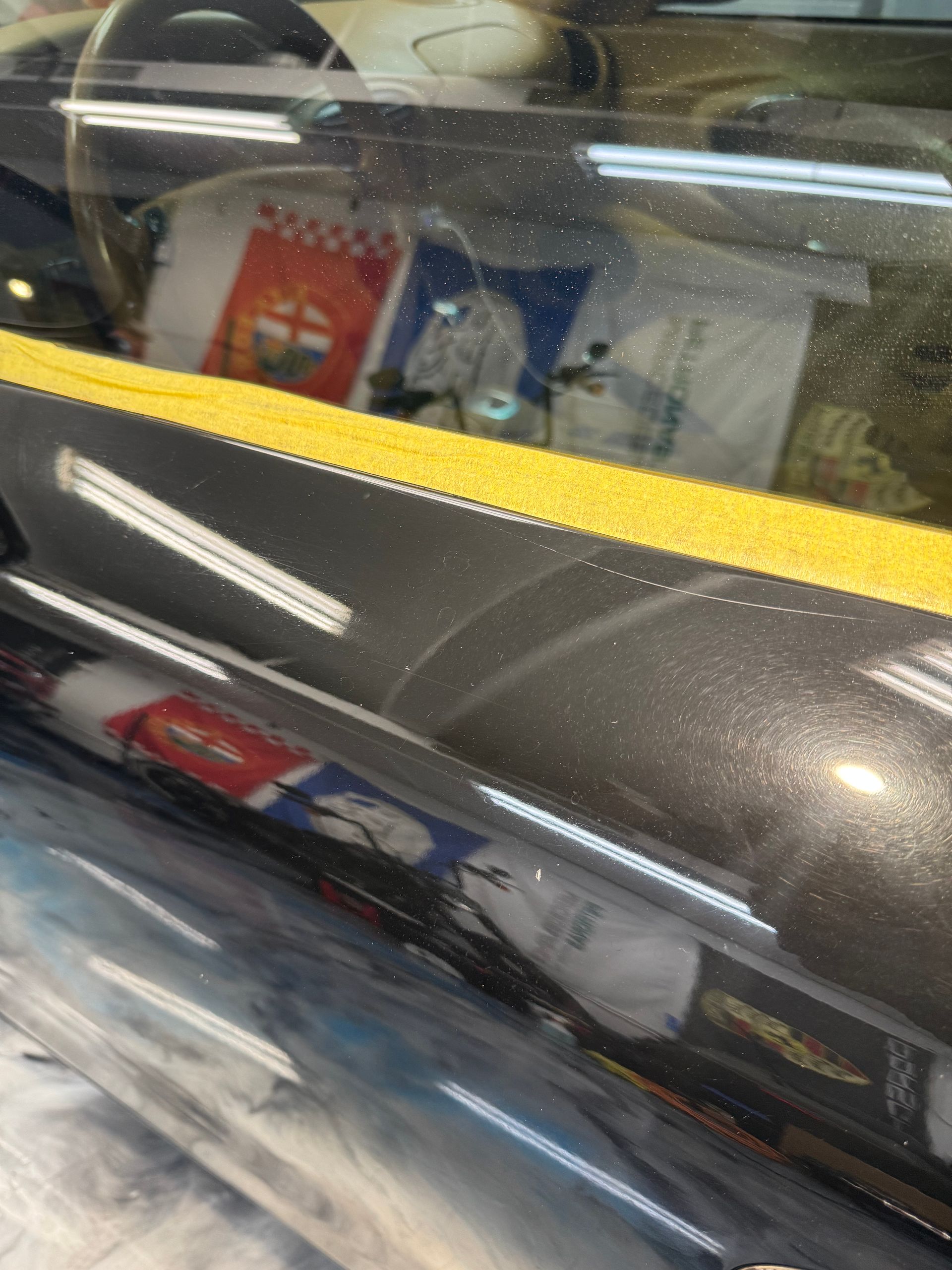 Porsche 911 panel before — scratches and swirls