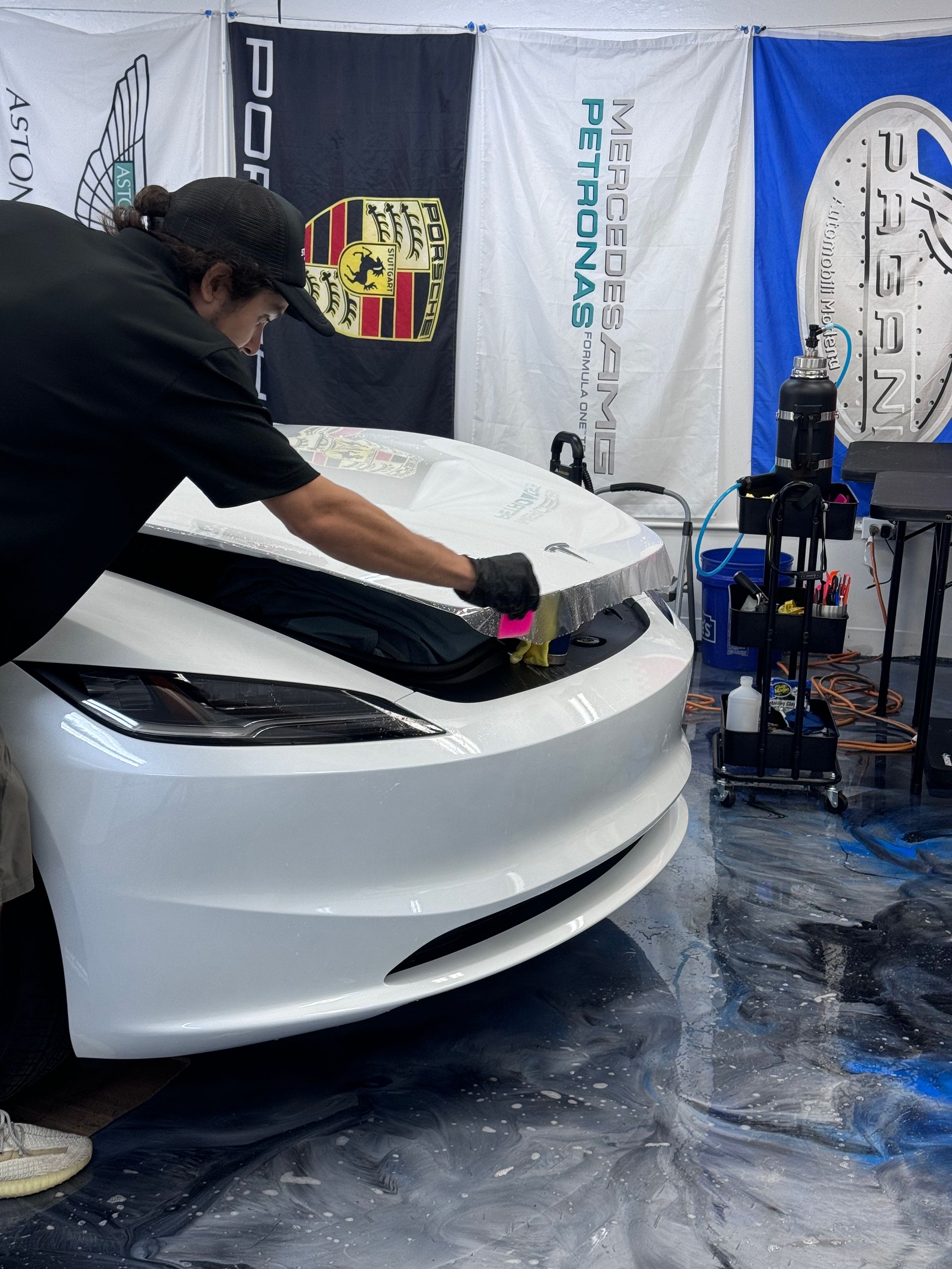 Traditional TPU paint protection film installation on Tesla — Standard Paint Protection Honolulu