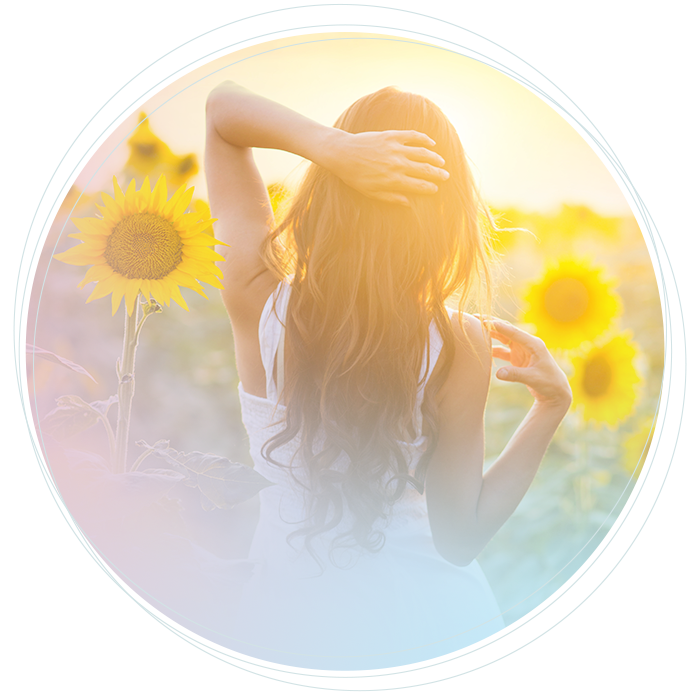a woman on a field of sunflowers