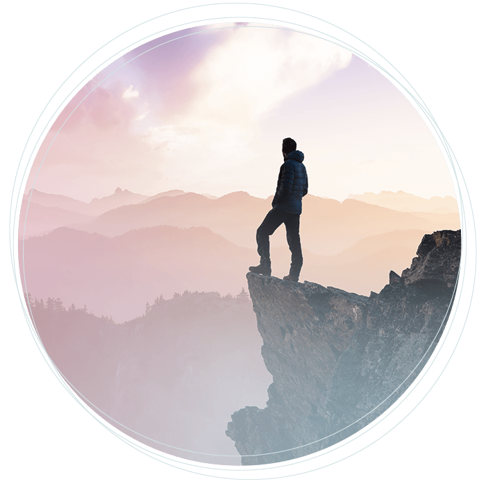 a man standing on the edge of a cliff