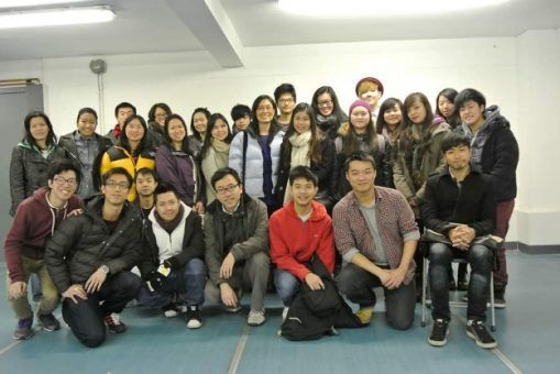 A group of people posing for a picture in a room