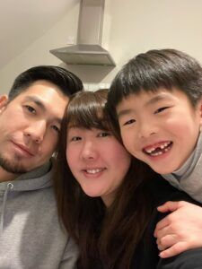 Zoe's family are posing for a picture together.