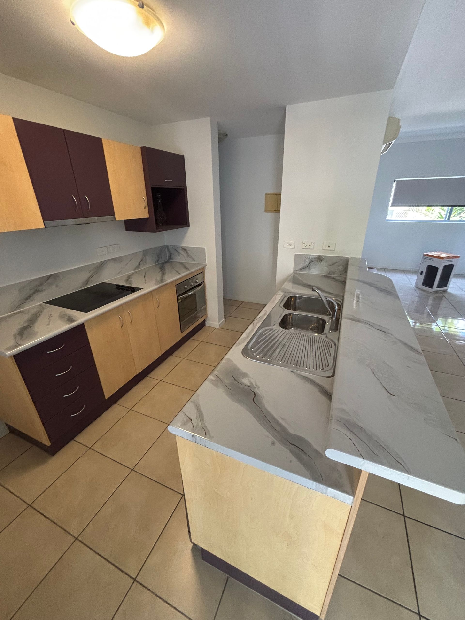 A Kitchen With White Cabinets and Counter Tops and a Sink — Supremacy Painting Co In White Rock, QLD