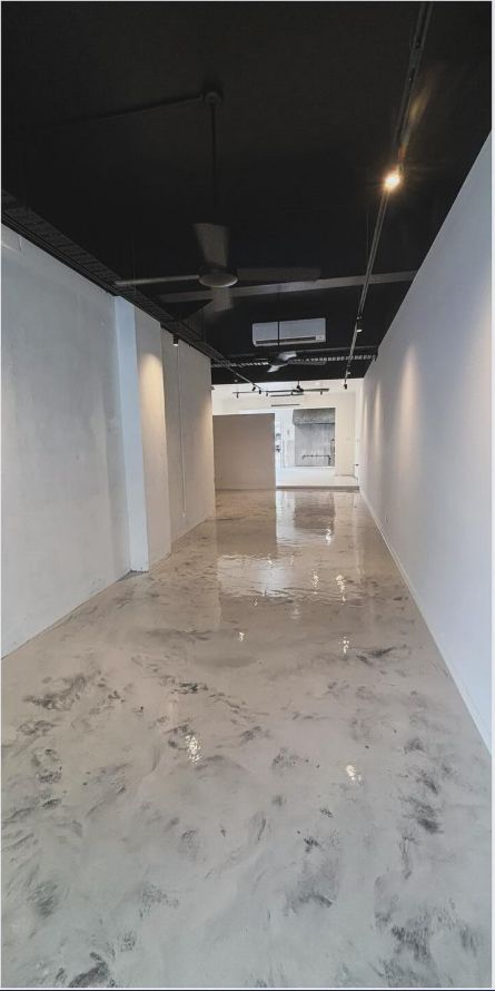 An Empty Room With a Marble Floor and a Black Ceiling — Supremacy Painting Co In White Rock, QLD