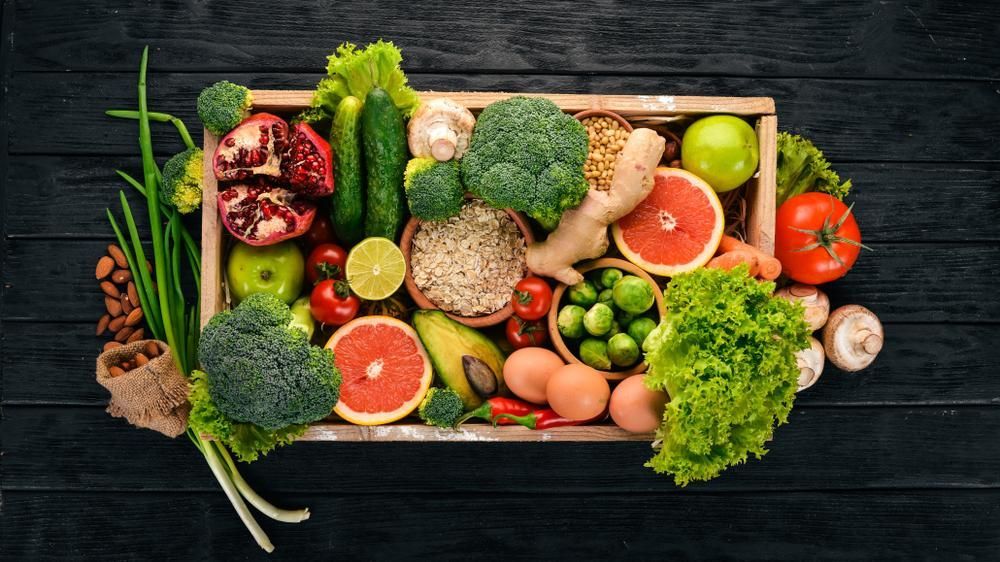 A Wooden Box Filled with Fruits and Vegetables on A Wooden Table — Gungahlin Kebab and Pizza in Gungahlin, ACT