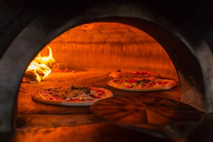 Two Pizzas Are Being Cooked in An Oven — Gungahlin Kebab and Pizza in Gungahlin, ACT