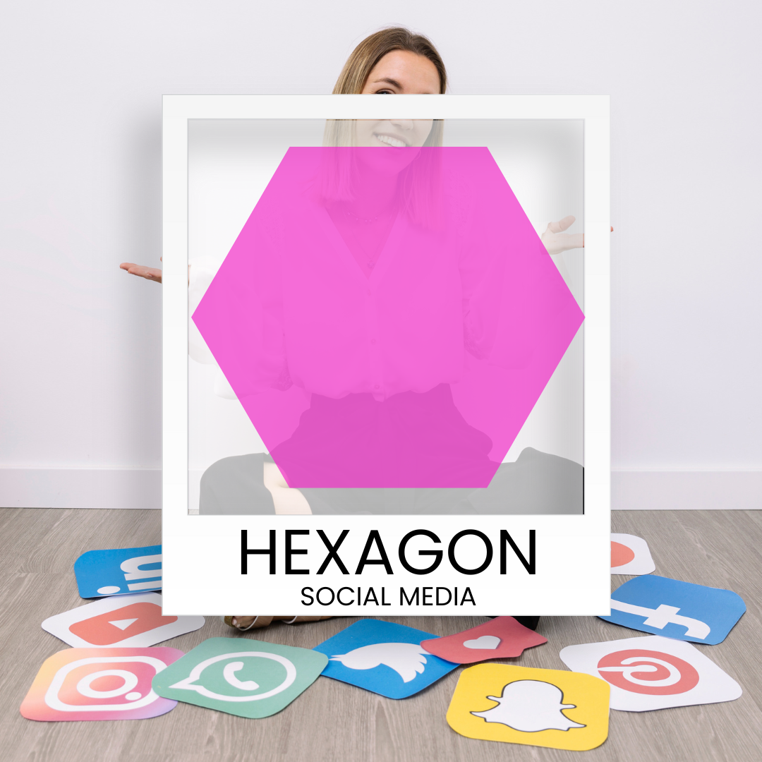 A woman is holding a picture of a pink hexagon surrounded by social media icons