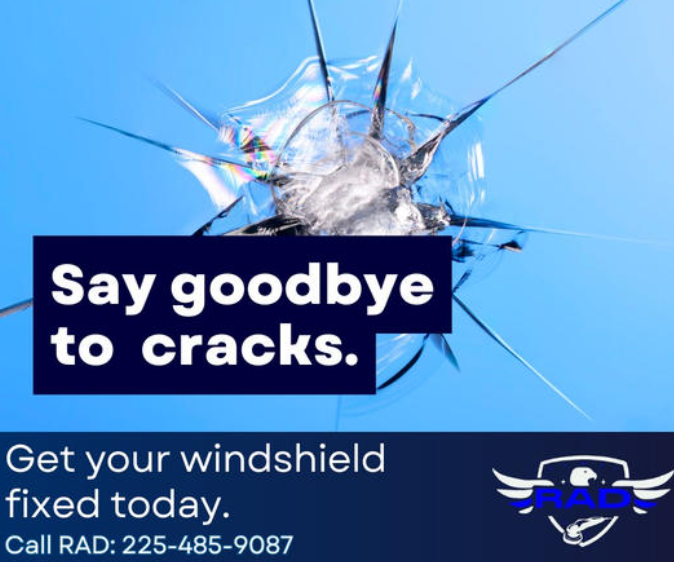 A broken windshield with the words say goodbye to cracks