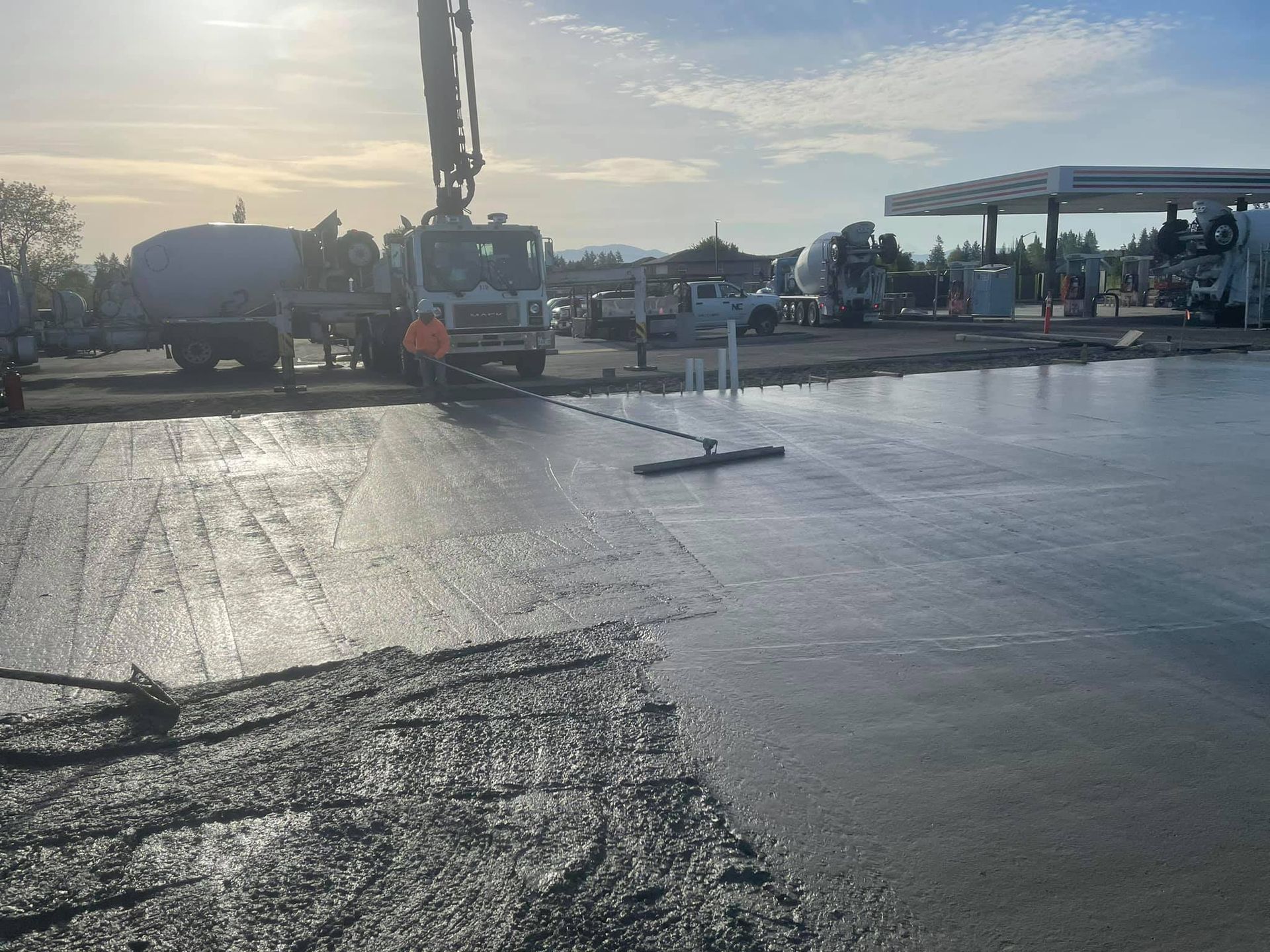 A crane is being used to pour concrete into a parking lot in Vancouver, WA