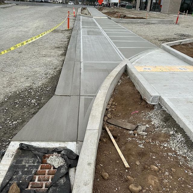 A sidewalk is being built on the side of a road in Vancouver, WA by NAVA Concrete LLC