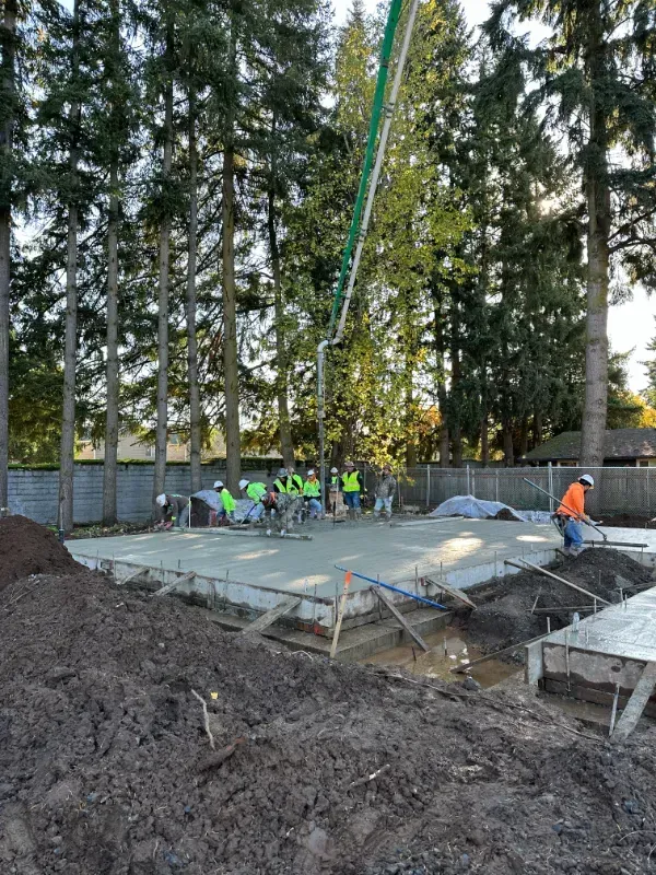 A concrete walkway is being built in front of a building under
construction in Vancouver, WA