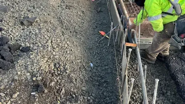A person is cleaning the ground with a mop