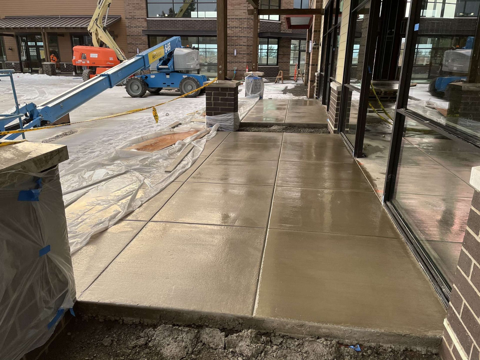 A concrete walkway is being built in front of a building in Vancouver, WA by NAVA Concrete LLC