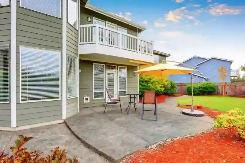 A spacious concrete patio with modern design elements, skillfully constructed by Nava Concrete LLC in Vancouver, Washington.