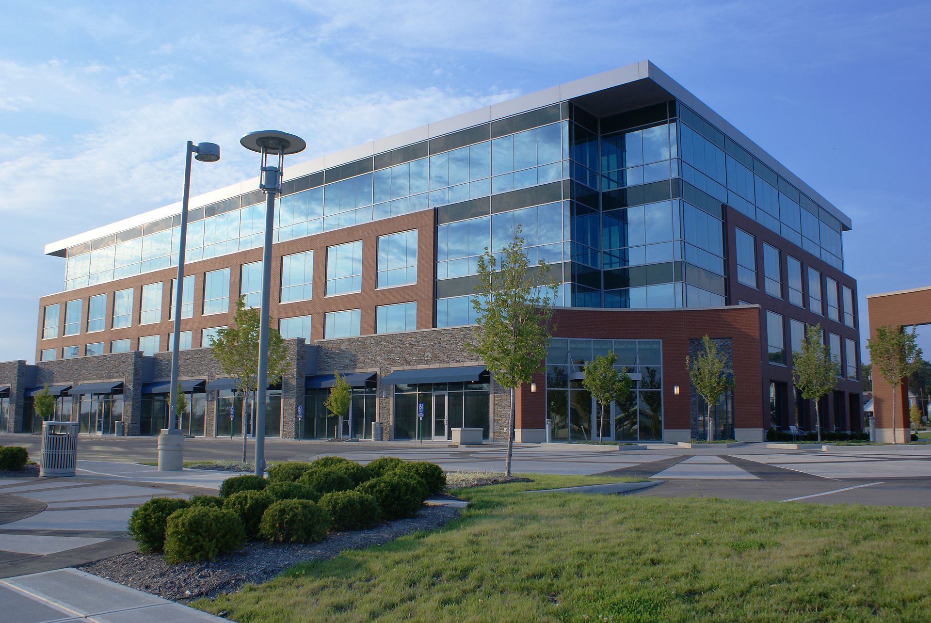 A large office building with a lot of windows in Vancouver Washington by Nava Concrete LLC.