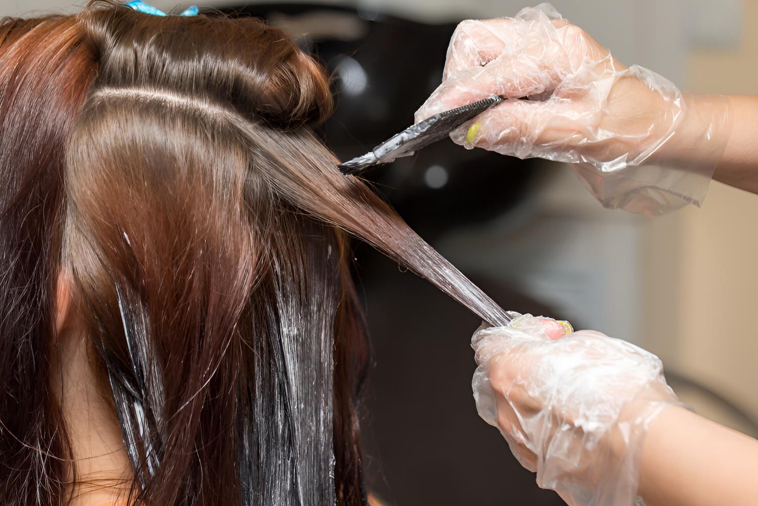 Woman is Getting Her Hair Dyed in a Salon — Lavie Hair & Beauty in Ciccone, NT