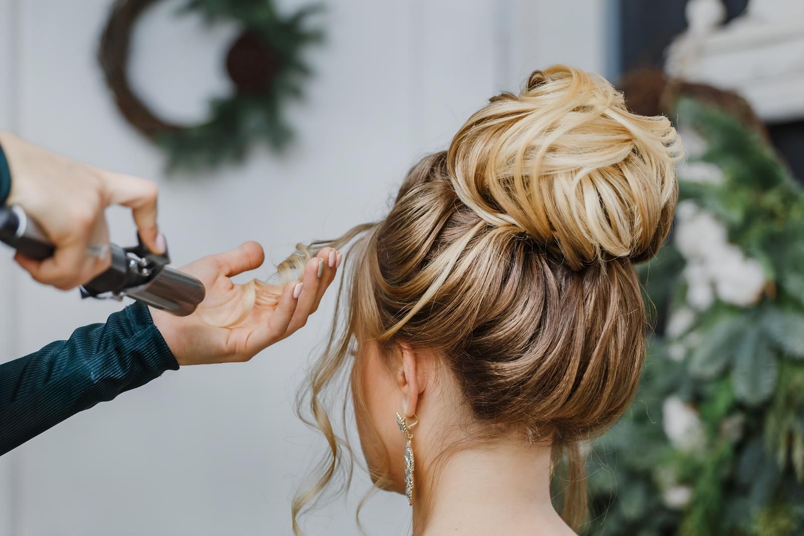 Woman is Getting Her Hair Done in a Bun — Lavie Hair & Beauty in Ciccone, NT