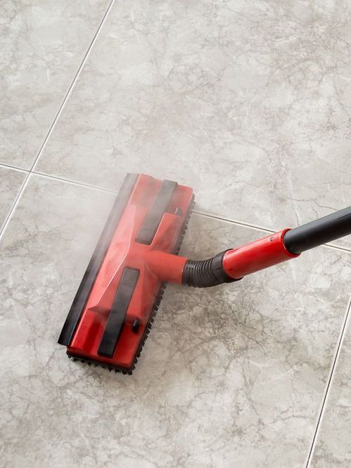 A Blue And White Broom Is Cleaning A Tiled Floor — Echo Carpet Cleaning In Wauchope, NSW
