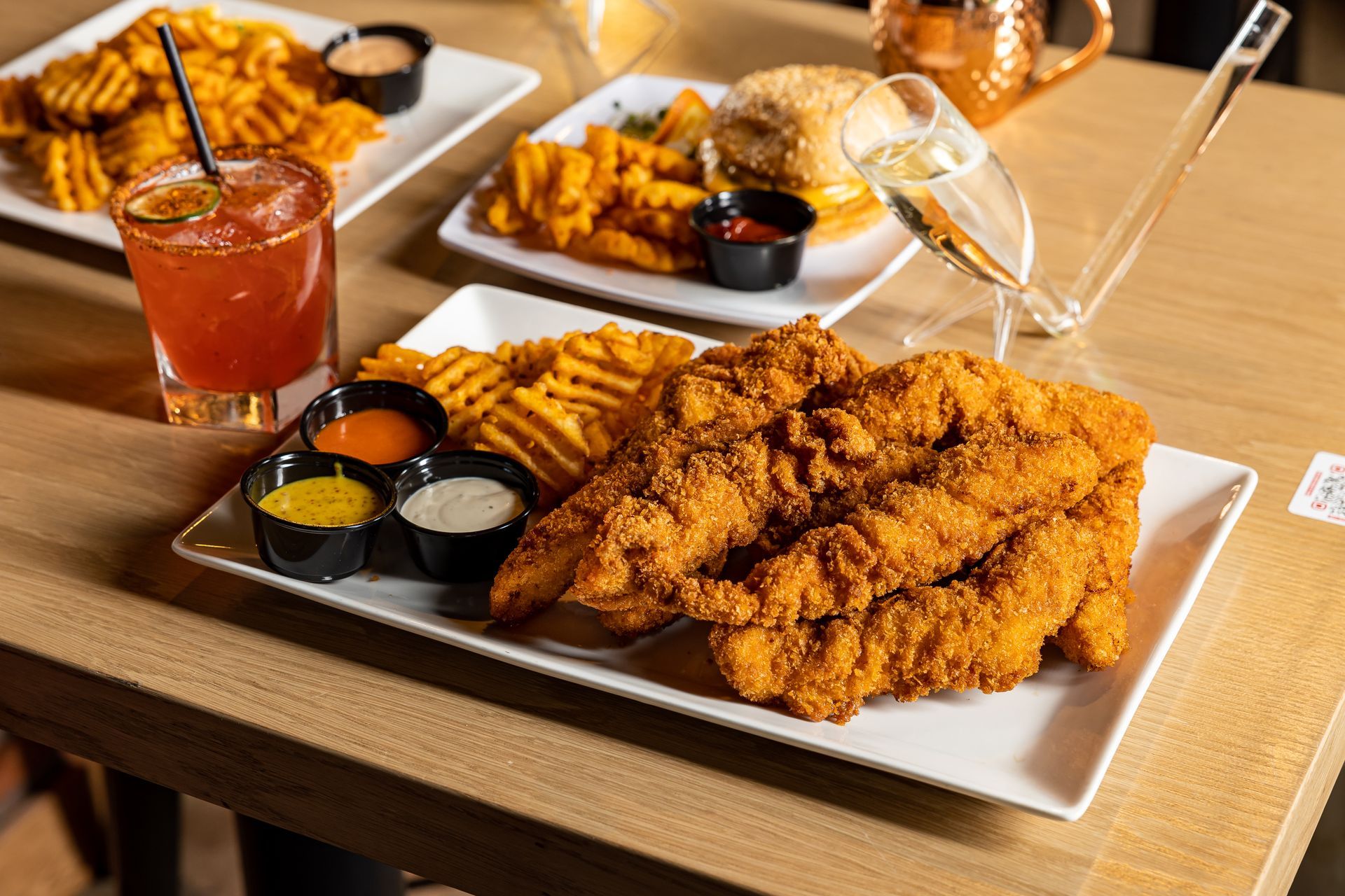 Chicken tenders plate with waffle fries from Tony Tenderonis in Denver Colorado near Coors Field