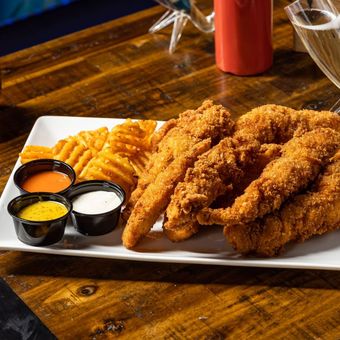 Chicken tenders plate with waffle fries from Tony Tenderonis in Denver Colorado near Coors Field